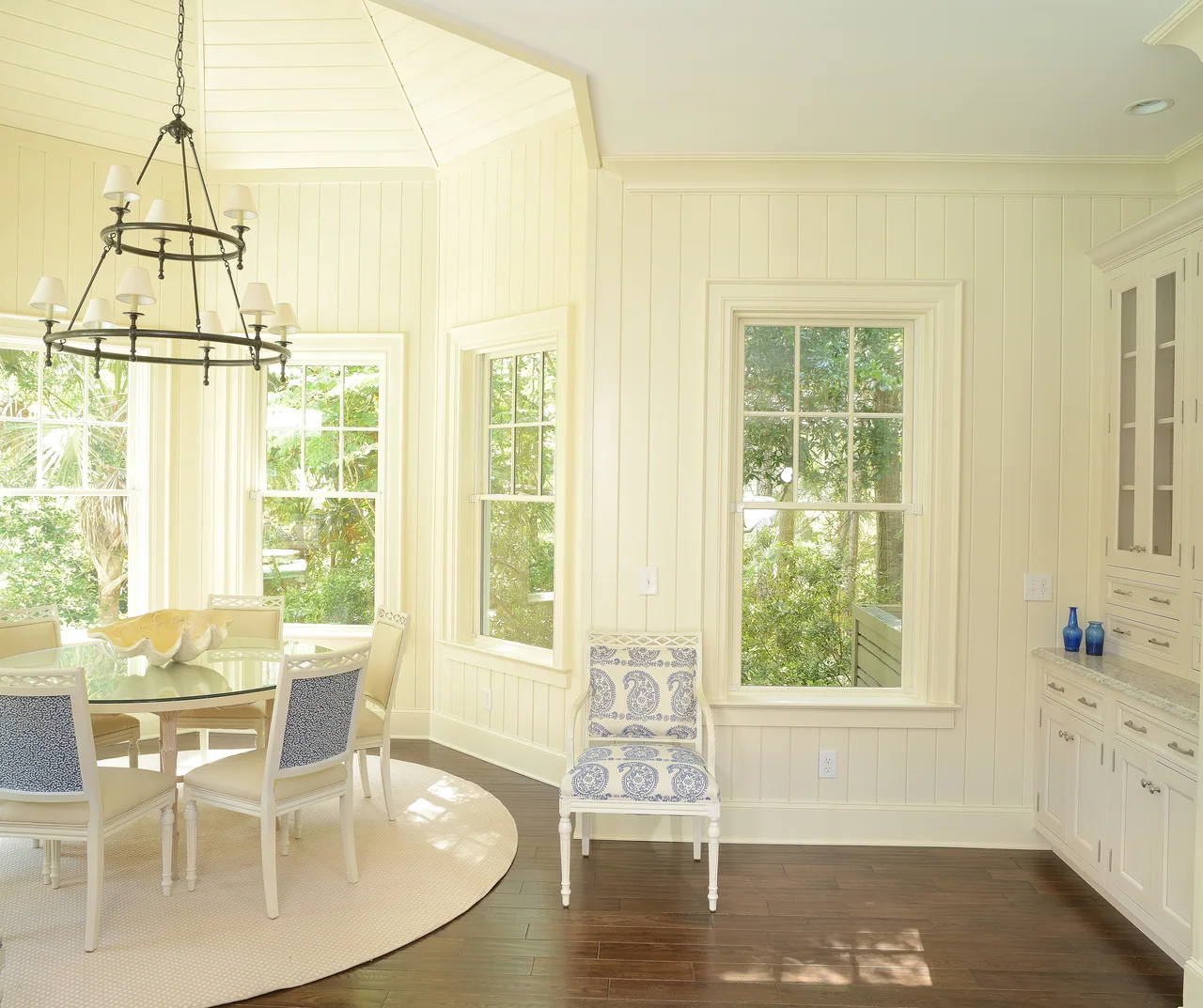 Dining area with a lantern pendant and garden views