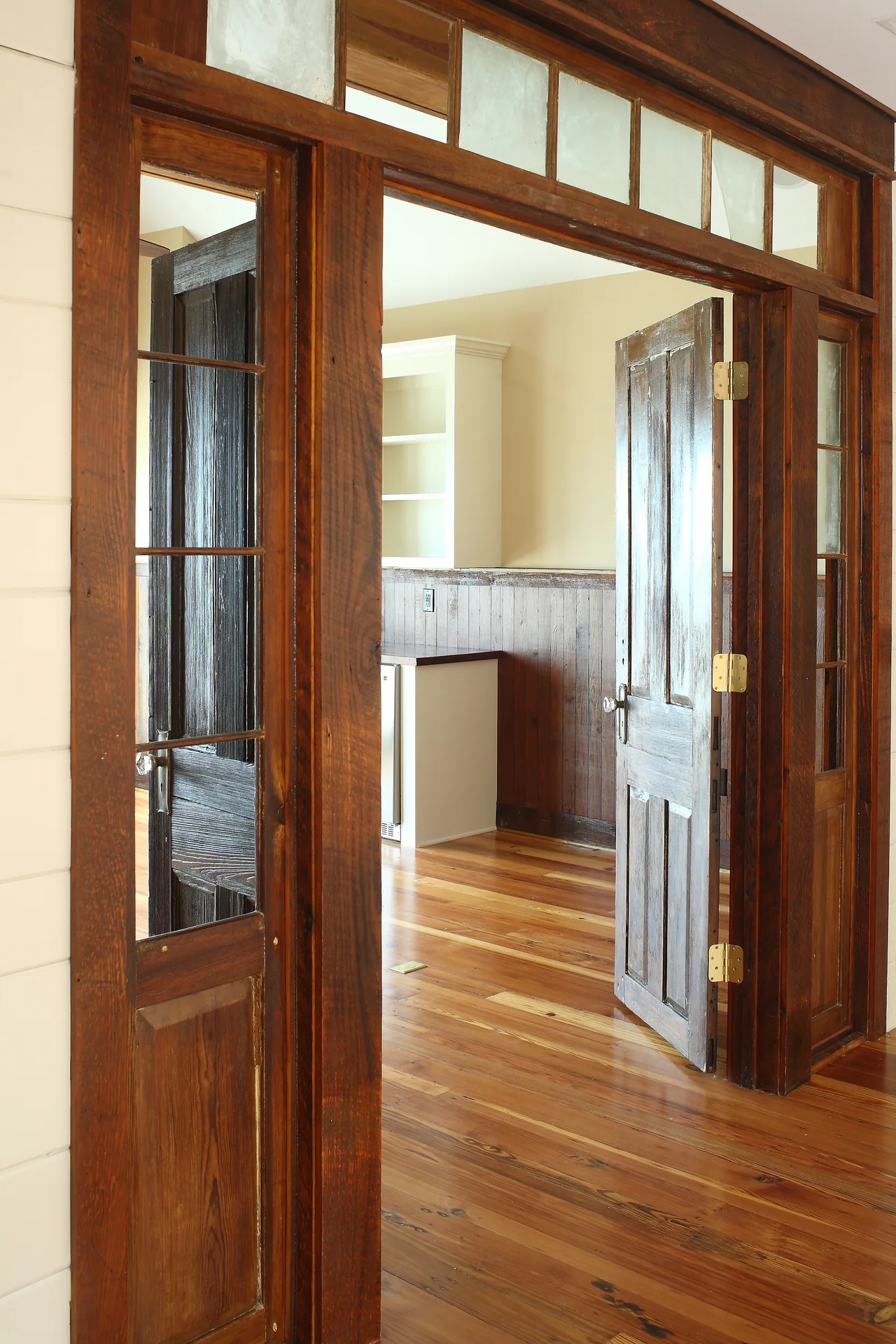 Upper hallway with wood doors and trim