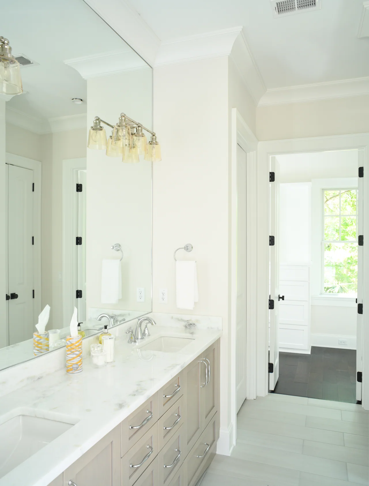 Bathroom with a long vanity and glass shower