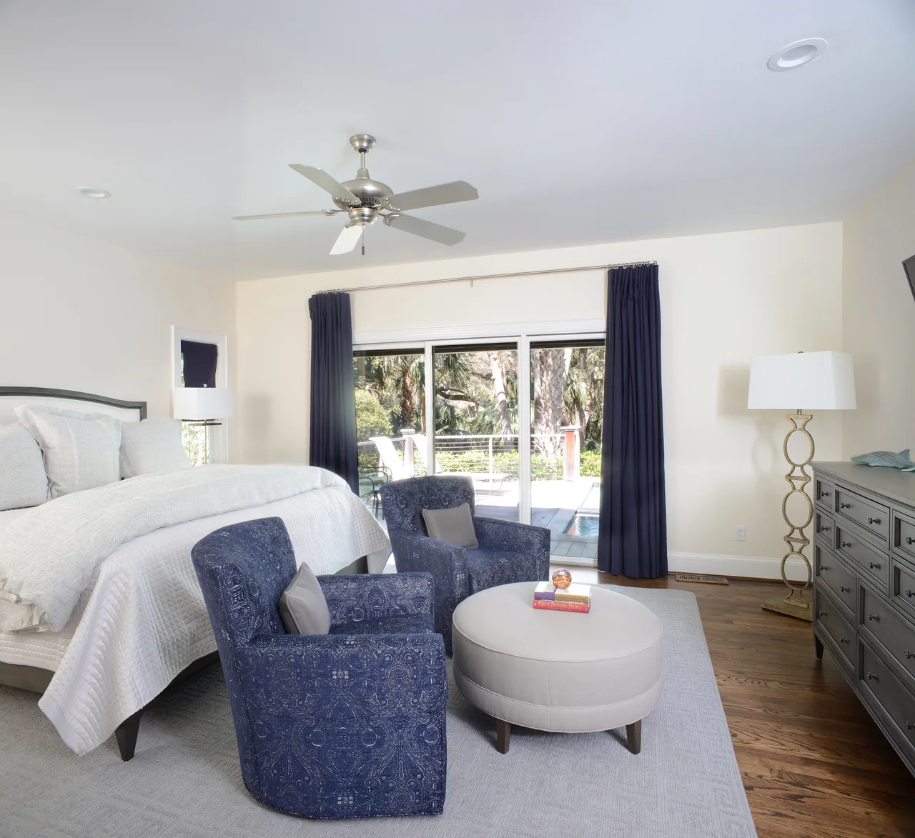 Bedroom with blue upholstered seating