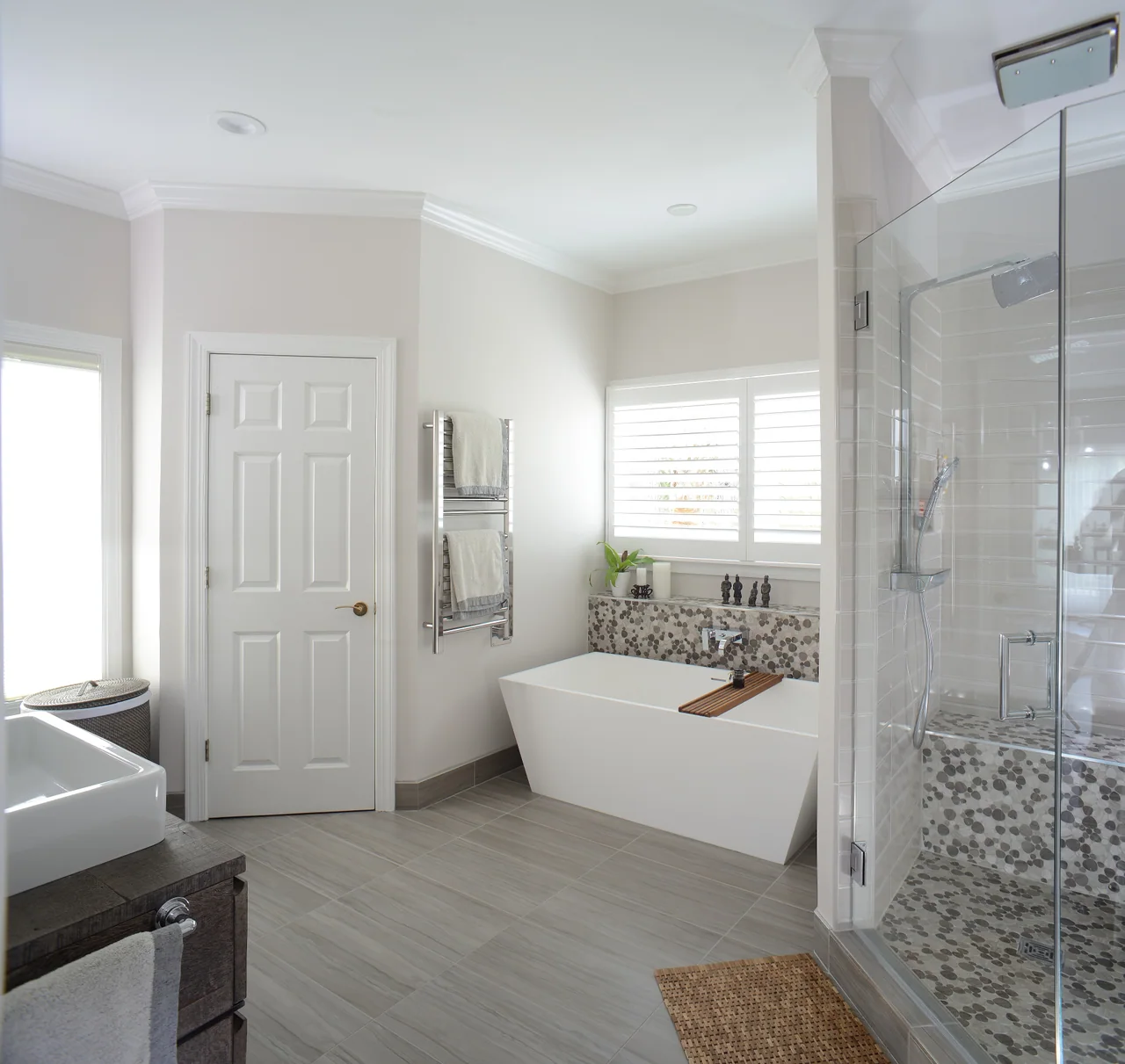 Bathroom with a glass shower and freestanding tub